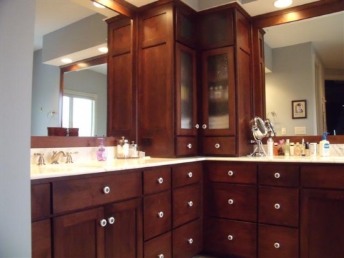 Shaker Style Doors and Drawers with a Unique Corner Cabinet and Mirror Frames to Match