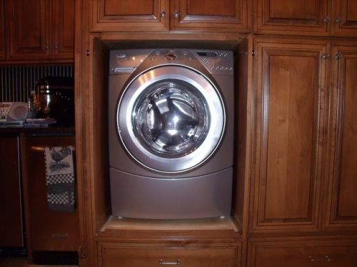 Built-ins with Flipper Doors to Hide Washer and Dryer